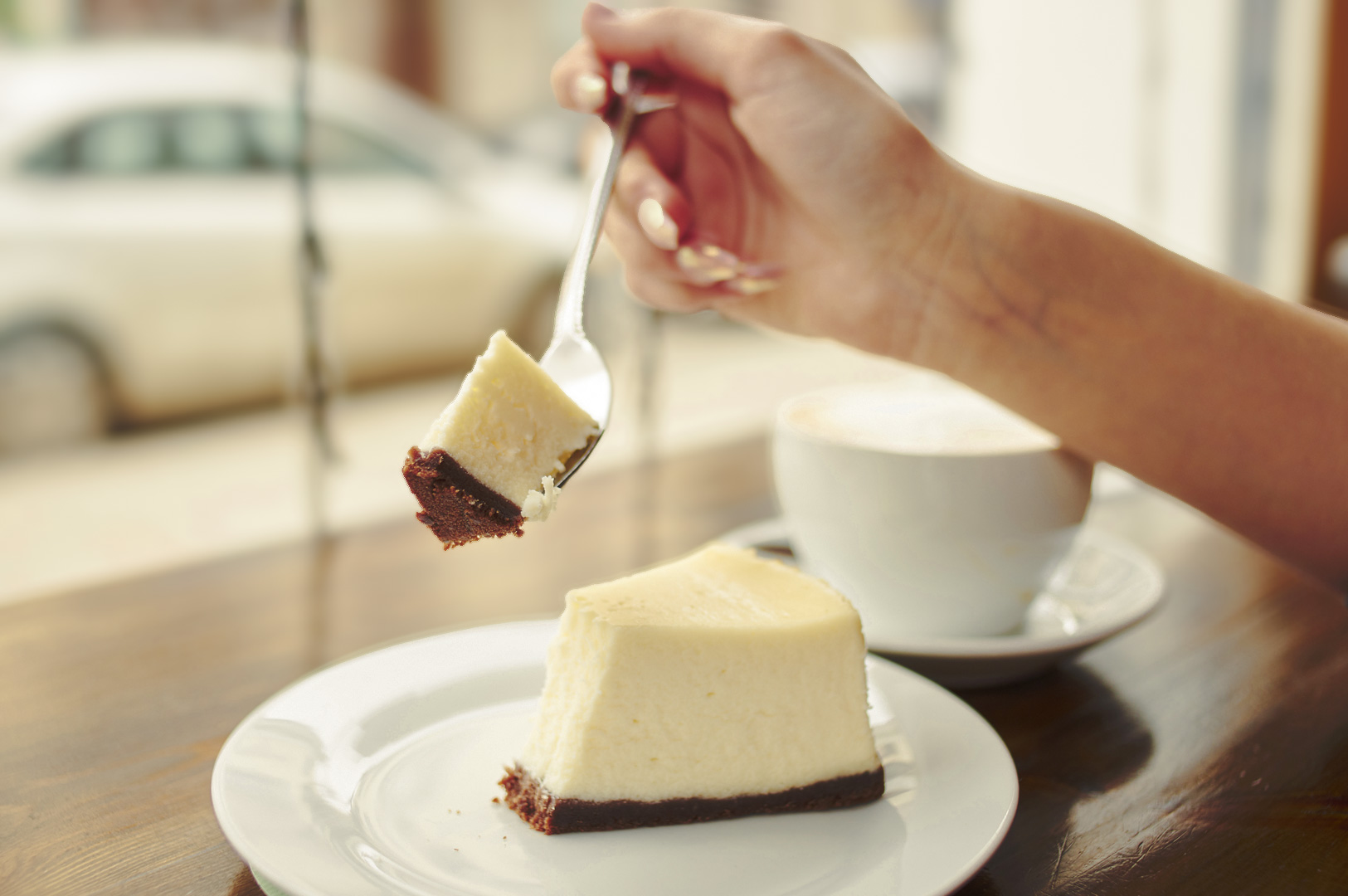 Detailed close‑up of a fluffy, airy cheesecake slice showing its soft, whipped texture